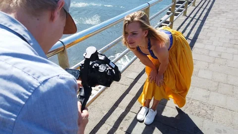 Stunning Female Posing in Front of the Camera then Walks Along Port 스톡 동영상 116023503