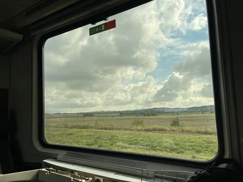 Stunning fields scenery in the window of a train Stock Photos