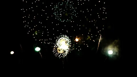 Stunning firework display lighting up the night sky with vibrant colors and 스톡 동영상 337464708