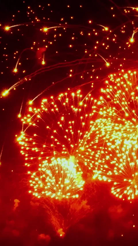 Stunning fireworks display illuminating the night sky over the cityscape Video stock 334922342