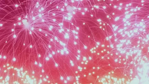 Stunning fireworks display lights up the night sky in vibrant colors Stock Footage 299544850