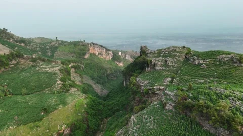 A Stunning Gorge of Mountains Between the Overgrown Cliffs Stock Footage 293535757