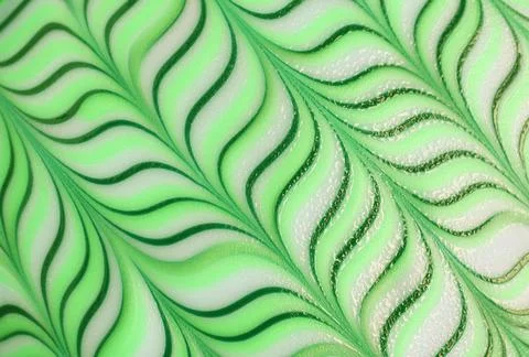 Stunning gradient green wavy pattern of a decorative doughnut for background 스톡 사진