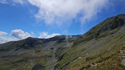 Stunning green ridges and wispy clouds in the Carpathian Mountains. Stock Footage 344041892