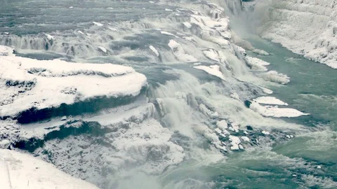 Stunning Gullfoss waterfall during winter covered with ice and snow Stock Footage 93471631