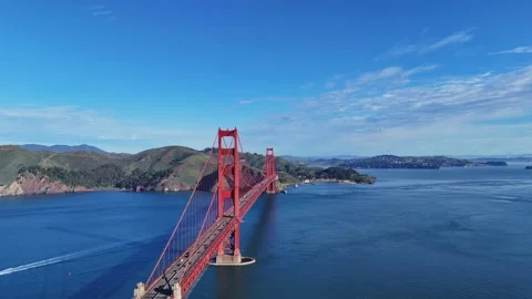 A stunning high-angle shot of the Golden Gate Bridge under a clear blue sky, Video stock 337824663