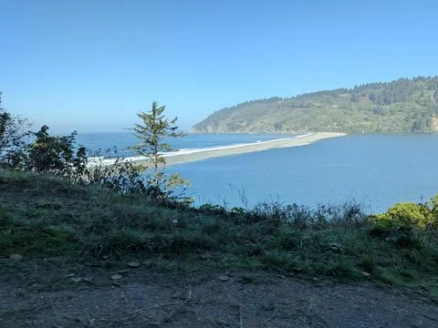 A stunning high-angle view of a wide river meeting the ocean Stock Photos