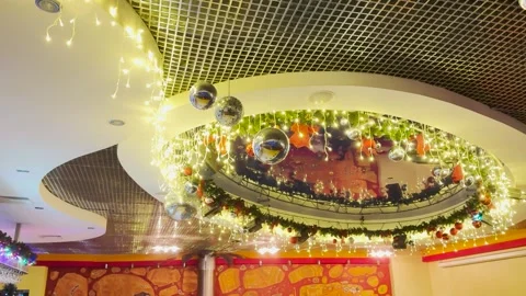 Stunning holiday ceiling decor, shining fairy lights, hanging disco balls Stock Footage 312727875