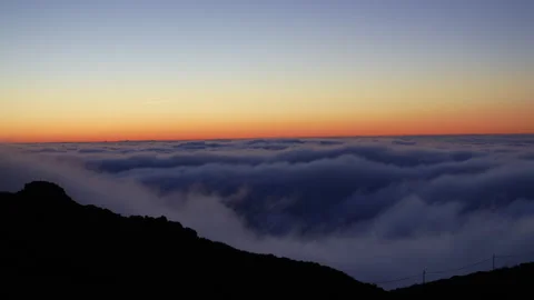 Stunning Horizon Cloudscape at Twilight with Silhouette Mountains Stock Footage 334592686