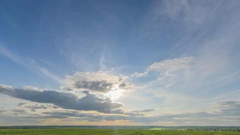 A stunning horizon displays dynamic cloud patterns that captivate the beholders Stock Photos