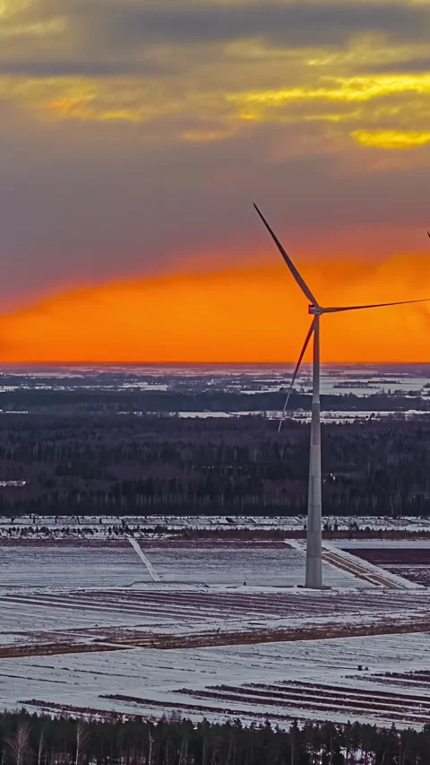 Stunning Hyperlapse of Windmills with Vibrant Sunset and Snowy Fields 스톡 동영상 331061621