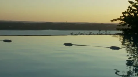 Stunning infinity pool at sunset 動画素材 8959457