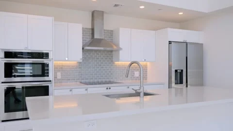 Stunning kitchen interior in new luxurious house with empty stone countertop and Stock Footage 247086239