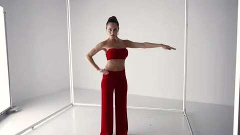 Stunning lady is dancing alone in studio, rehearsing modern dance style 動画素材 168330115