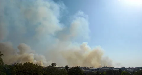 Stunning landscape 4k time lapse of a Fierce Fire between the factories Stock Footage 211450943