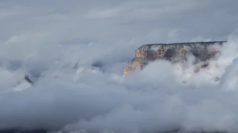A stunning long-lens timelapse of clouds & the North Rim of the Grand Canyon Stock Footage