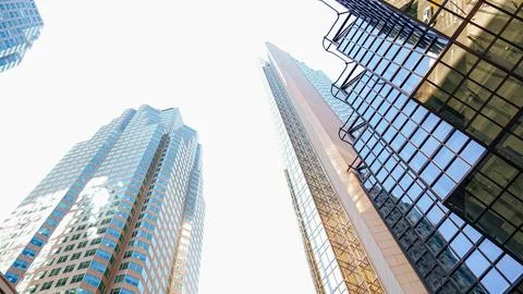 A stunning low-angle view highlights the grandeur of modern skyscrapers reach Stock Photos