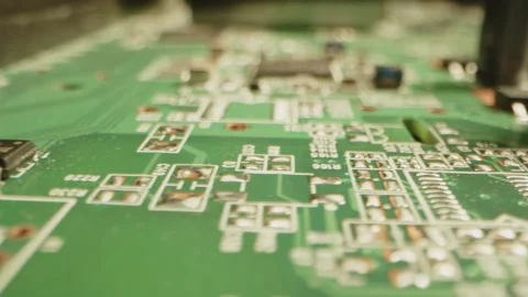 Stunning macro dolly of microchips, transistors and diodes on circuit board Video stock 315629622