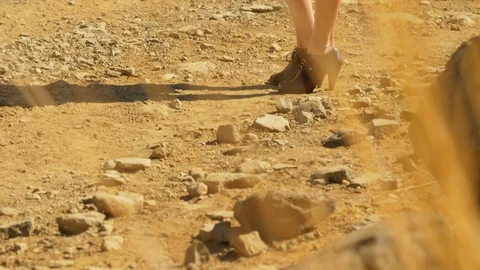 Stunning Model Wears Sunglasses While in Pathway Surrounded by Rocks Video stock 114174630