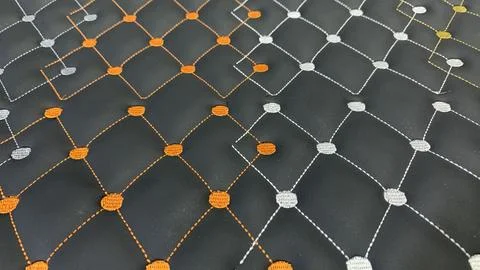 Stunning modern black quilted pattern with orange and silver stitching Stock Photos