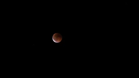 Stunning Moon Eclipse Against a Starry Background Stock Footage 324632144