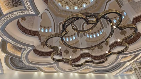 Stunning mosque interior showcasing intricate Islamic calligraphy and geometric Stock Footage 311584405