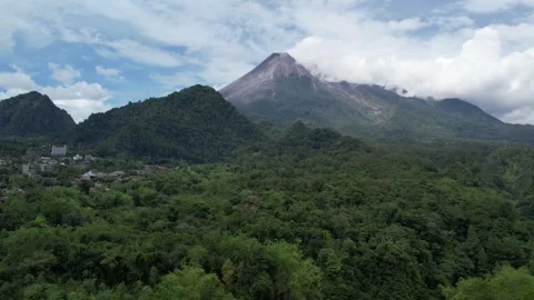 Stunning Mount Merapi Sunrise with Clear Skies and Rural Farmland Below Stock Footage 321648784
