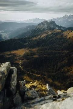 A stunning mountain range surrounded by trees and rocks Stock Photos
