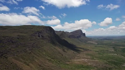 Stunning Mountain Range Under Blue Sky with Clouds on Sunny Day Видео 332725183