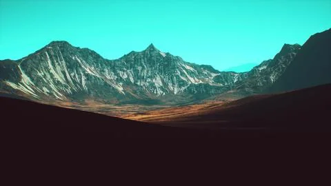 Stunning mountain range under a clear blue sky during daylight hours Stock Illustration