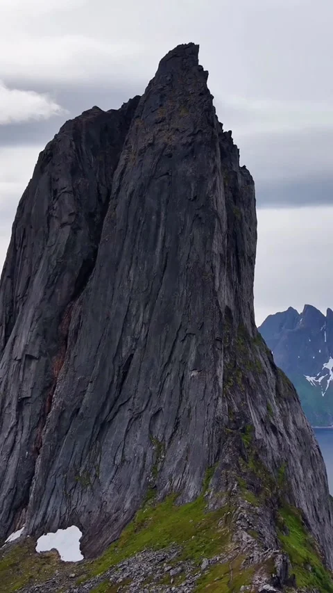 Stunning mountain scenery. Rugged cliffs and snowy mountain summits. Majestic Stock Footage 327917581