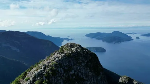 Stunning mountain summit next to the Ocean, Aerial shot Stock Footage 289565986