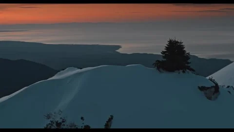 Stunning mountain sunset illuminates snowy landscape Video stock 320338580