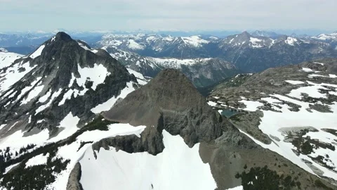 Stunning Mountain Views with Drone, Wide Angle, Spring Snow Stock Footage 169558380