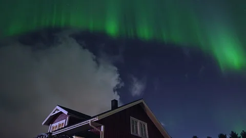 Stunning northern lights dancing in the night sky with brilliant green hues.. Stock Footage 323969495