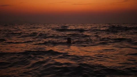 Stunning Ocean Sunset with Gentle Waves on the Shore Stock Footage 303575185