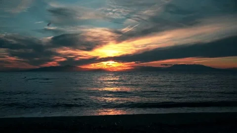 Stunning ocean sunset time lapse with vibrant colors painting the sky and c.. Stock Footage 339464911