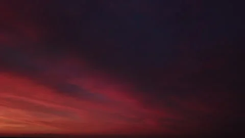 Stunning Orange and Red Sunset Pan Left to Right Stock Footage 313857477