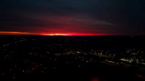 Stunning Orange Sky Sunset with Car Lights and Cloud Cieling Stock Footage 292663646