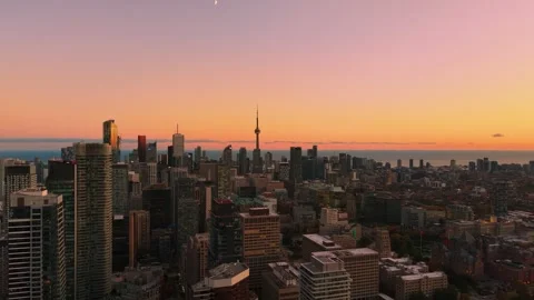 Stunning panoramic drone view in peach pink tones of modern downtown skyscrapers 스톡 동영상 320530741