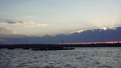 Stunning panoramic shot of summer evening sunset in cloudy sky over small yacht Stock Footage 94031973