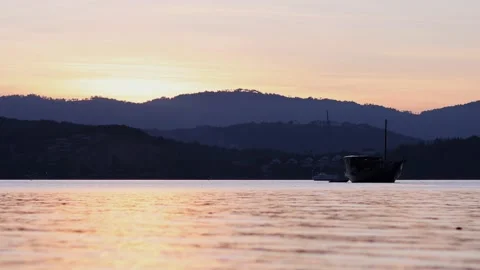 Stunning panoramic view of bay against mountains on horizon with beautiful Stock Footage 233885669