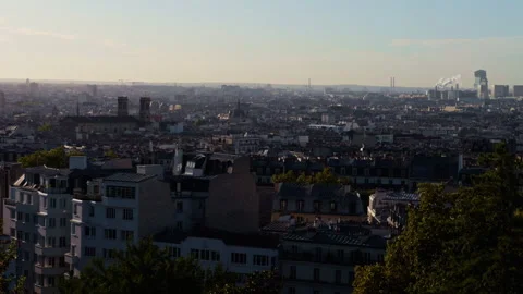 A stunning panoramic view of the cityscape of Paris during sunset, showcasing Stock Footage 318496155