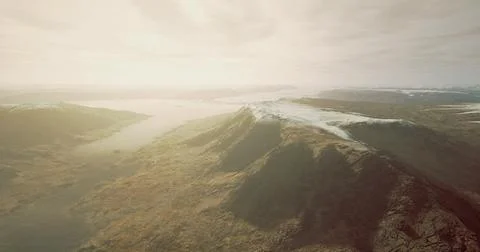 Stunning panoramic view of mountainous landscape during hazy afternoon light Stock Illustration