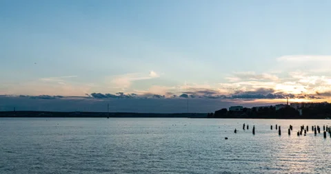 Stunning panoramic views of the bay against the horizon with sunset and orange Stock Footage 137627612