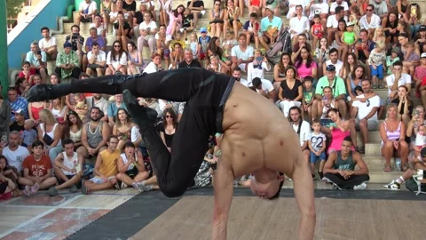 Stunning performance of male acrobat on bars in front of audience Stock Footage 206979292