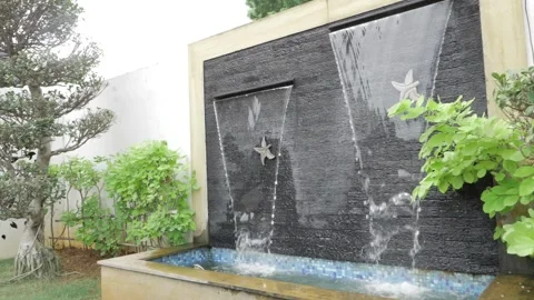 Stunning Poolside Oasis with Waterfall and Star-Patterned Walls Stock Footage 320914091