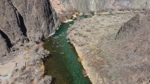 Stunning river flow in a deep mountain gorge. Morning light, Central Asia Stock Footage 332690821