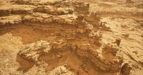 Stunning rock formations in a remote desert landscape under bright sunlight 스톡 일러스트