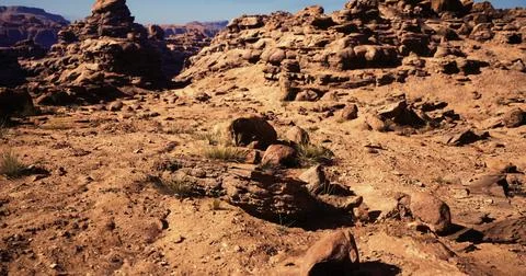 Stunning rock formations under clear blue sky in arid landscape Stock Illustration